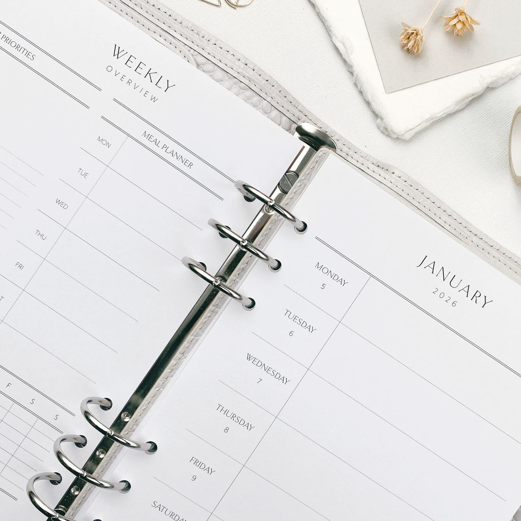 Weekly planner with dashboard layout on a white surface