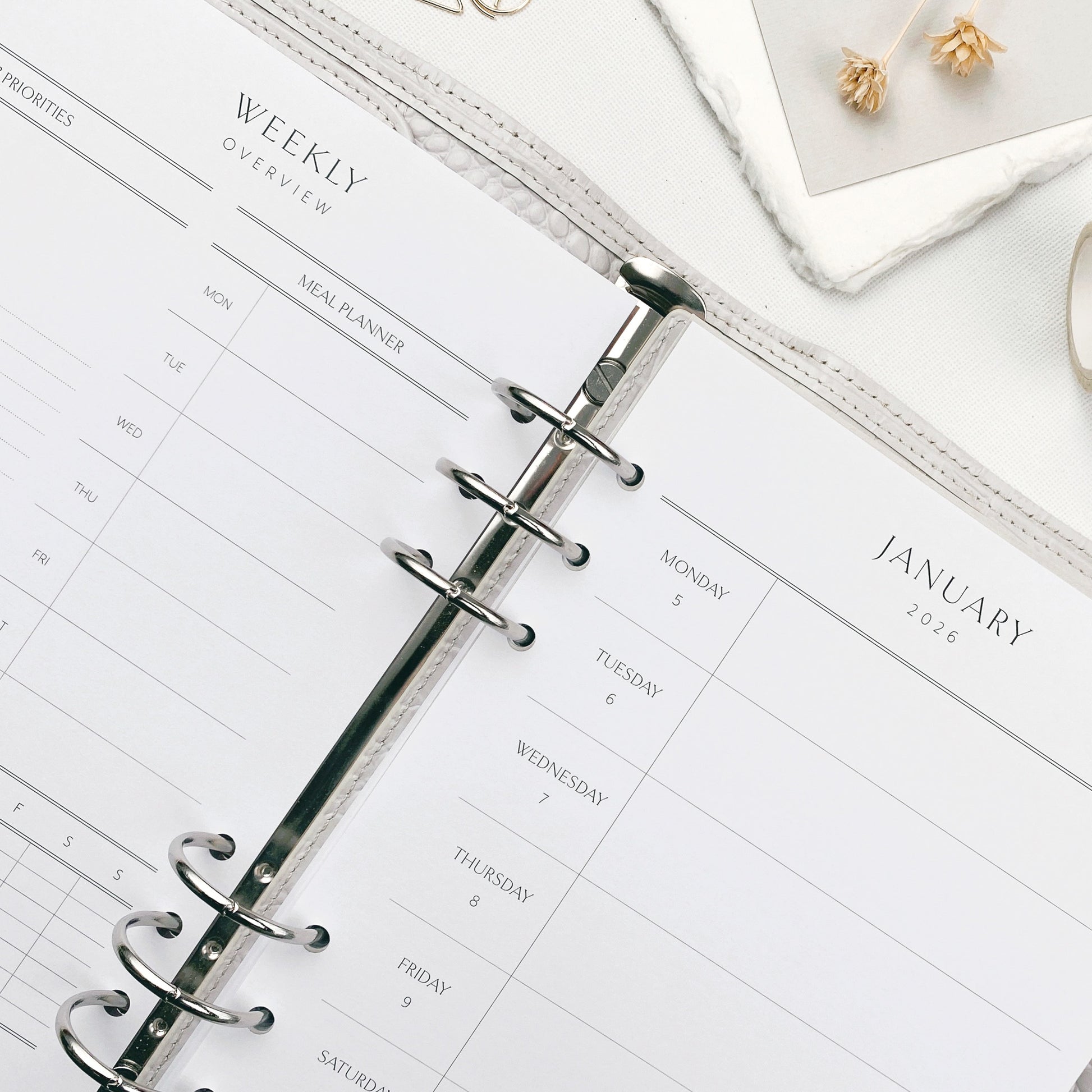 Weekly planner with dashboard layout on a white surface