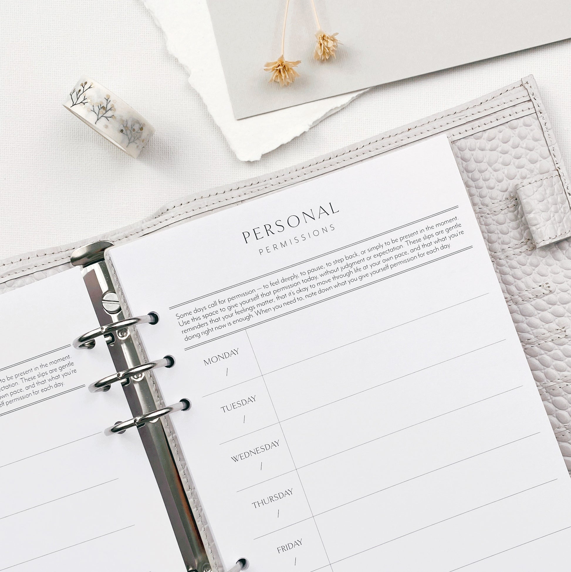 Planner open to a personal permissios slip page on a white surface