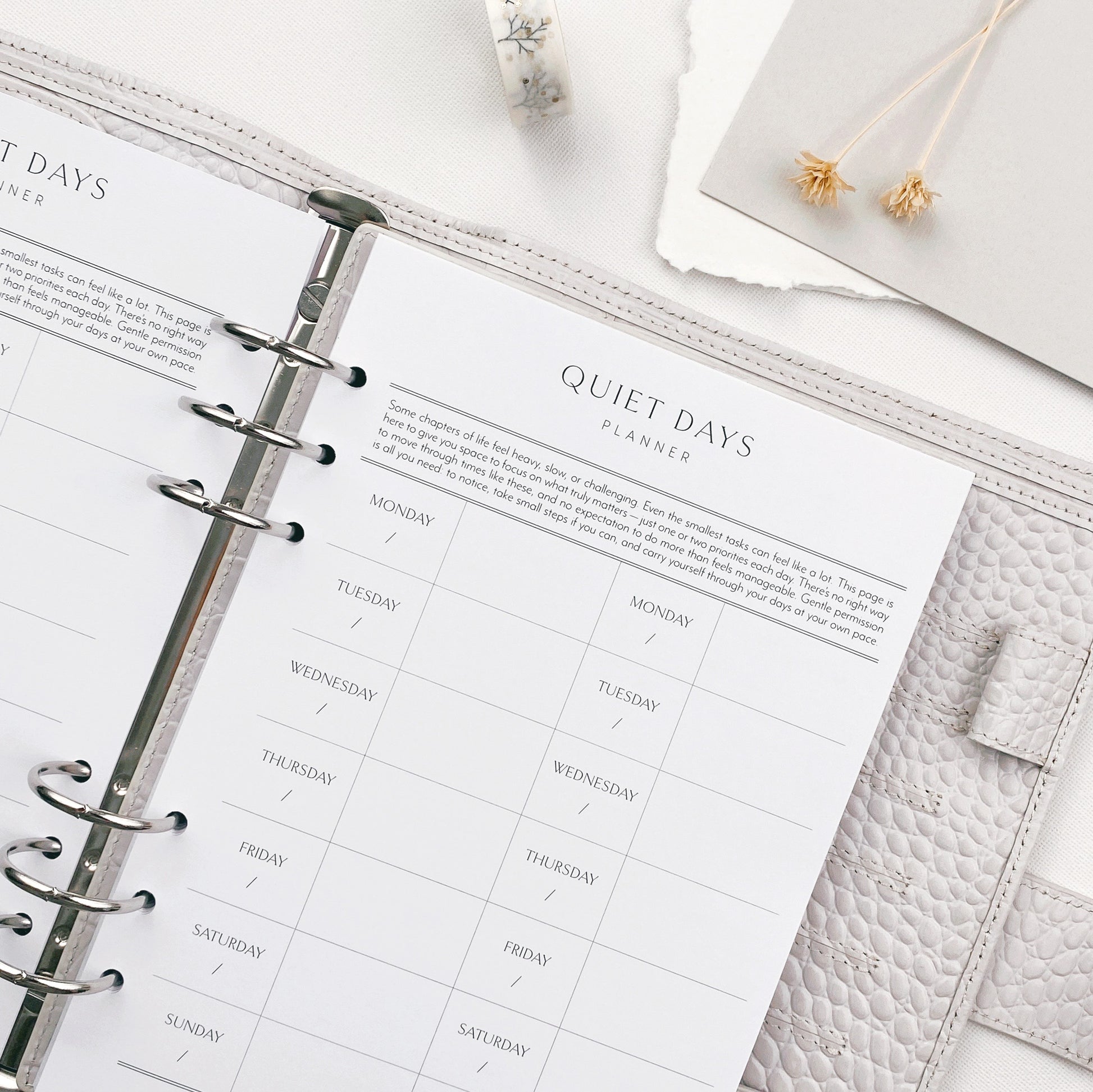 Planner binder open to a quiet days page design