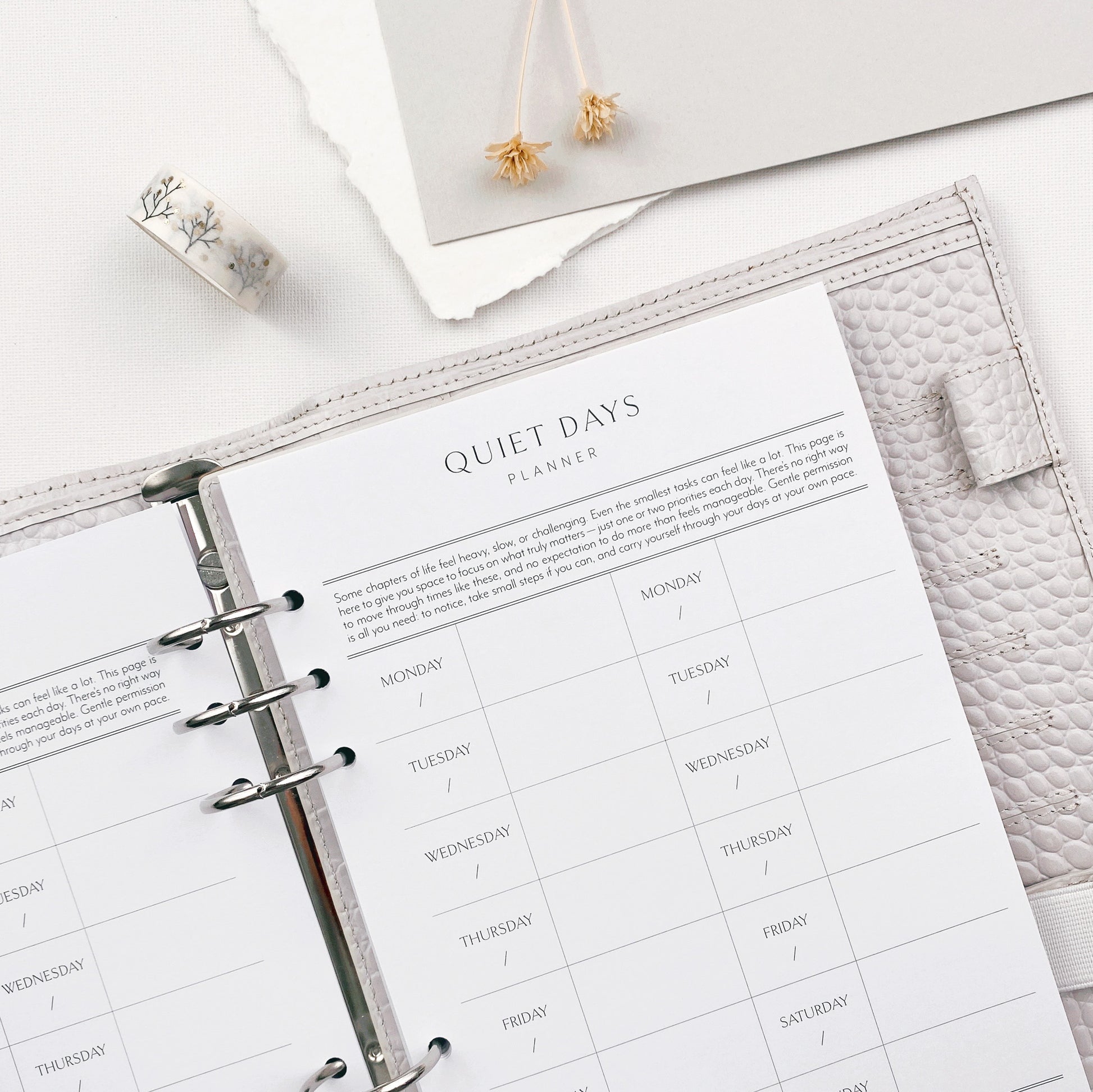 Planner binder open to a quiet days page design