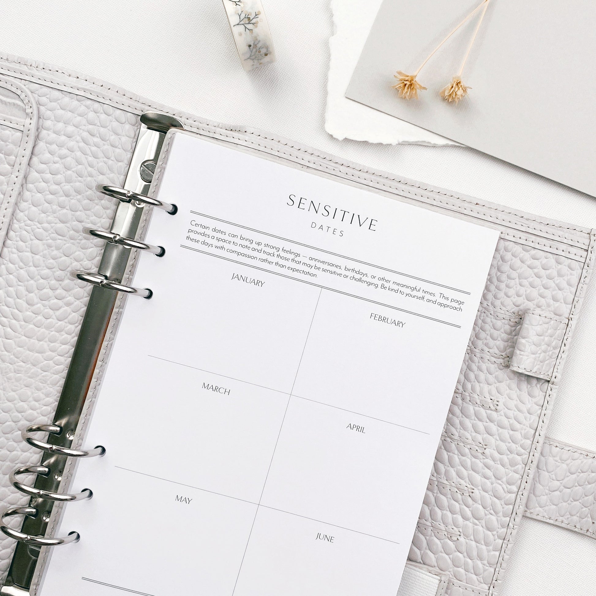 A5 organiser open to a Sensitive Dates Planner page