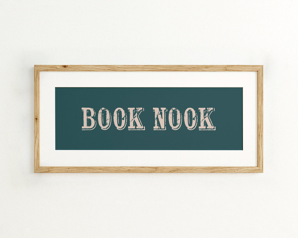 Framed artwork with 'BOOK NOOK' text on a teal background