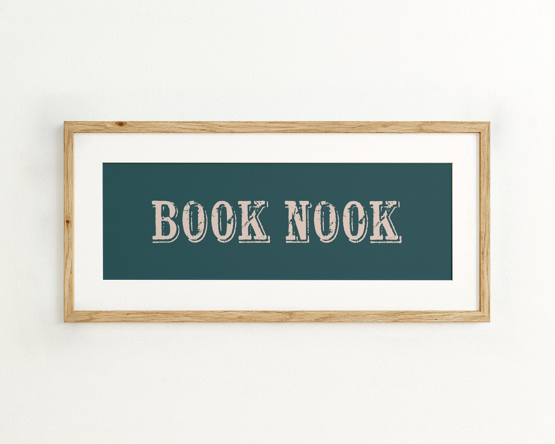 Framed artwork with 'BOOK NOOK' text on a teal background