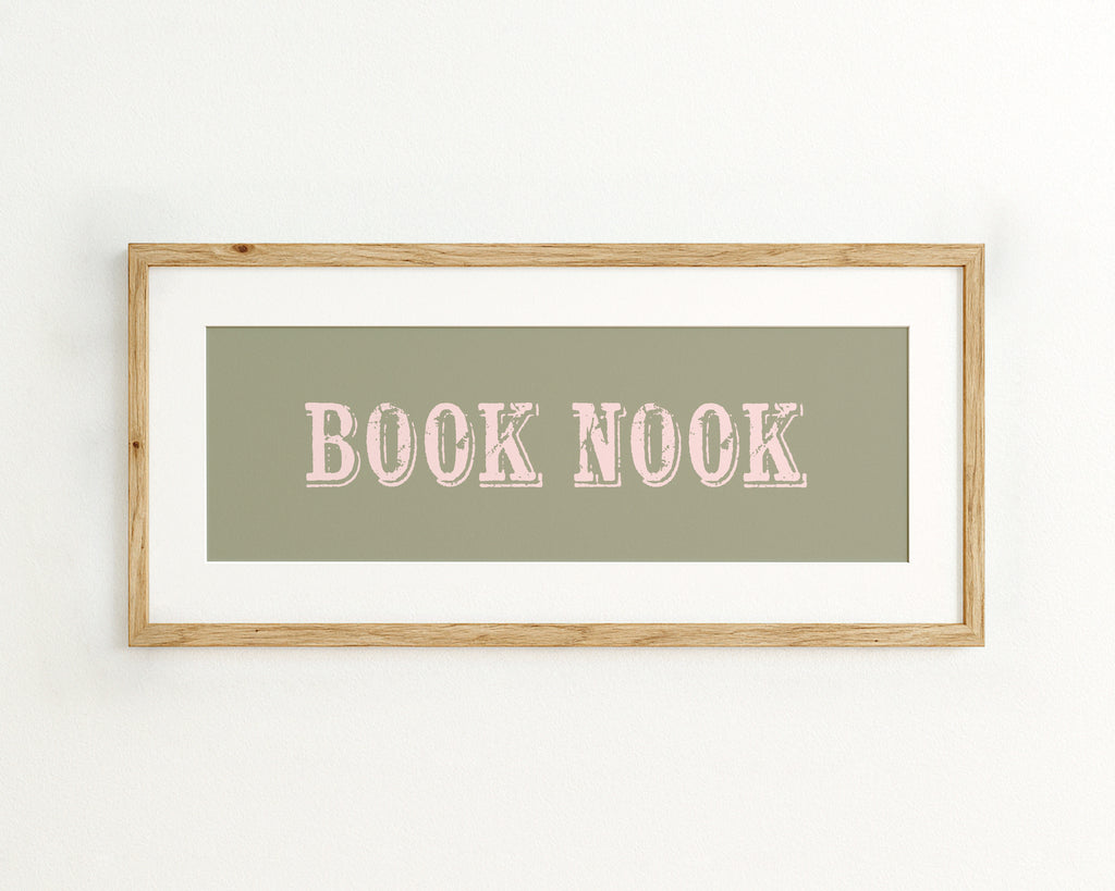 Framed artwork with 'BOOK NOOK' text on a green background