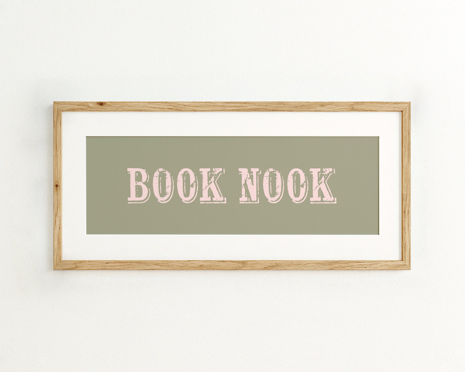 Framed artwork with 'BOOK NOOK' text on a green background