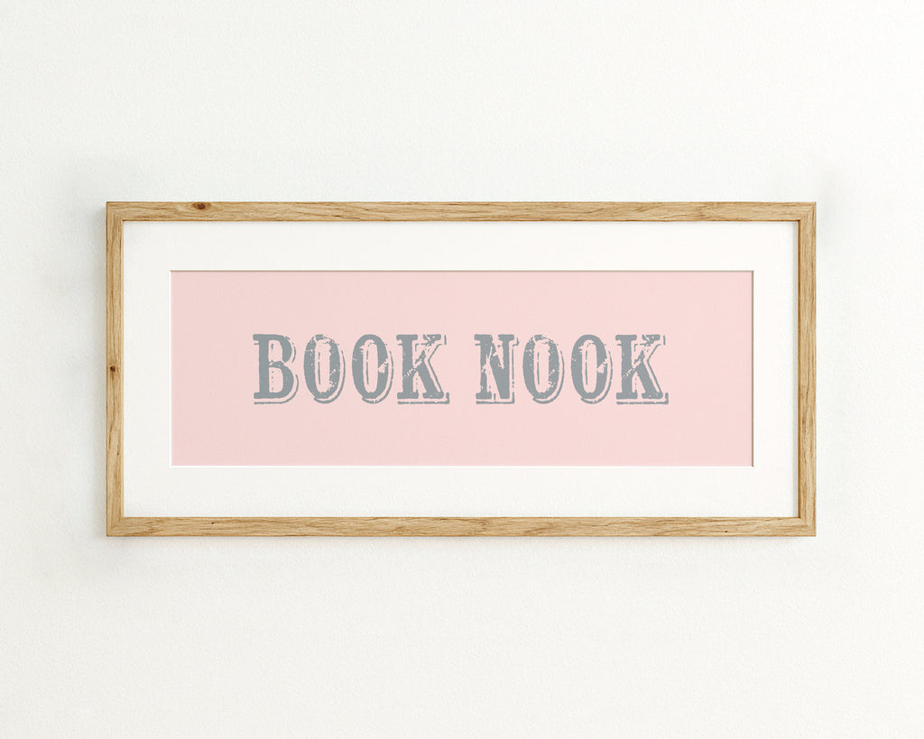 Framed print with 'BOOK NOOK' text on a pink background