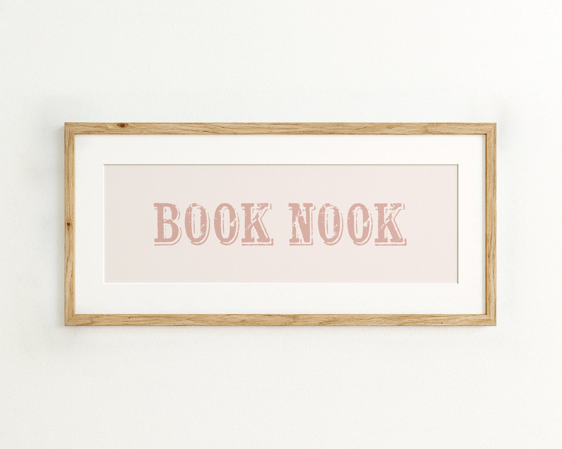 Framed print with 'BOOK NOOK' text on a light background