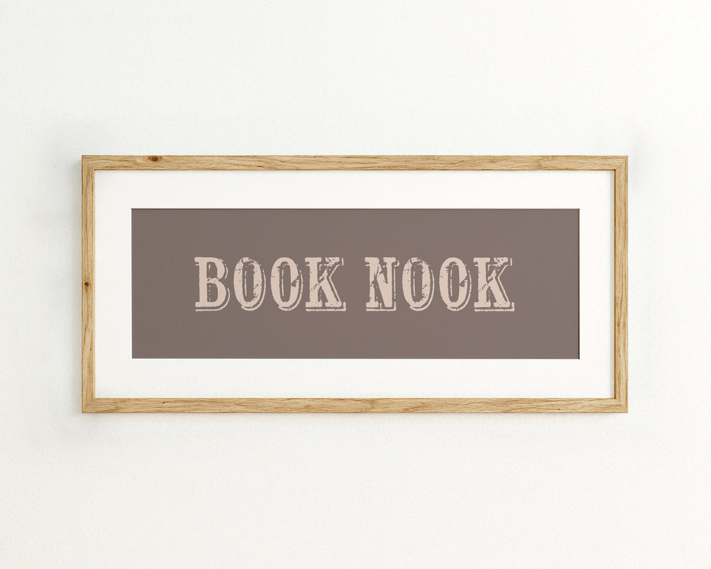Framed artwork with 'BOOK NOOK' text on a brown background