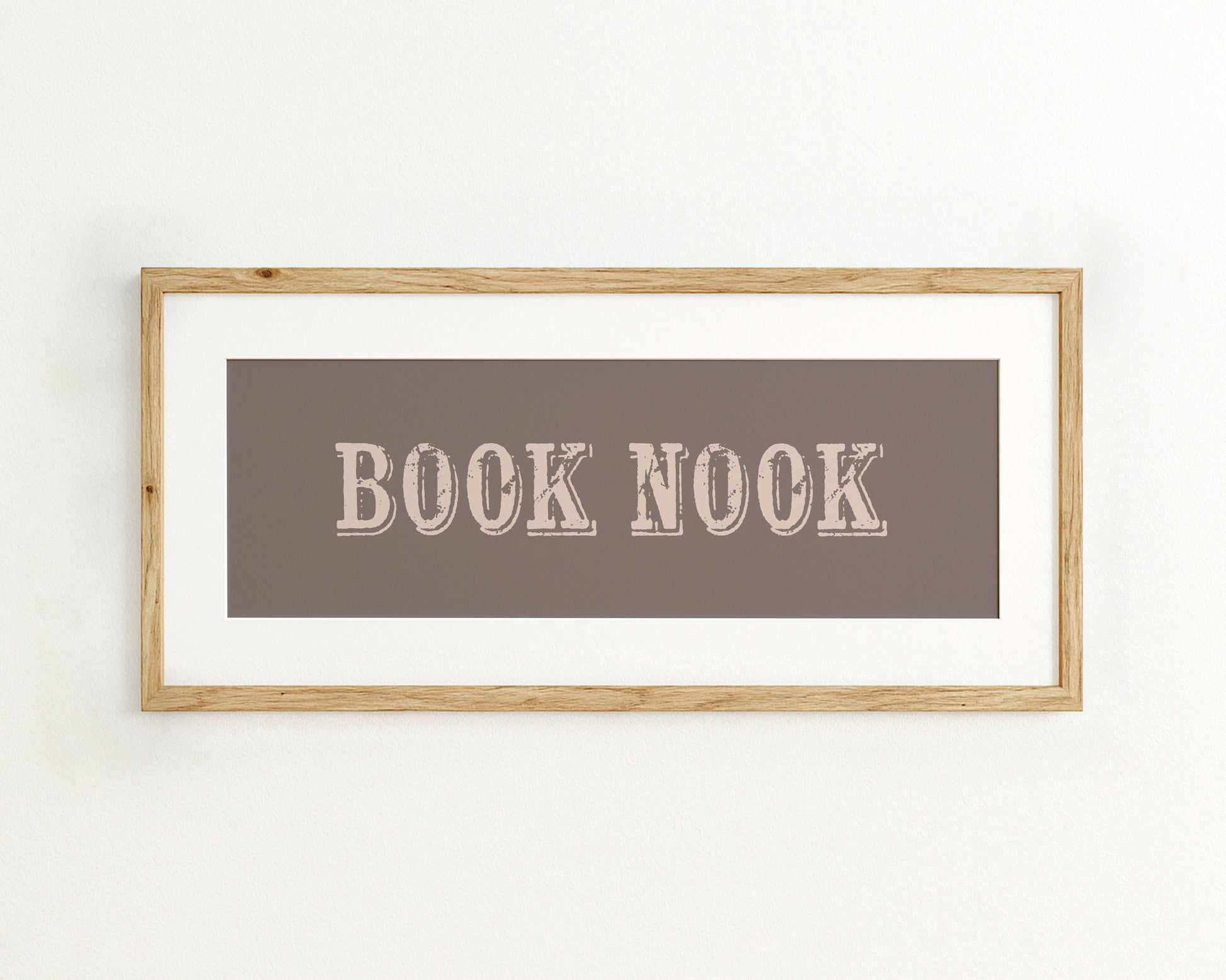 Framed artwork with 'BOOK NOOK' text on a brown background