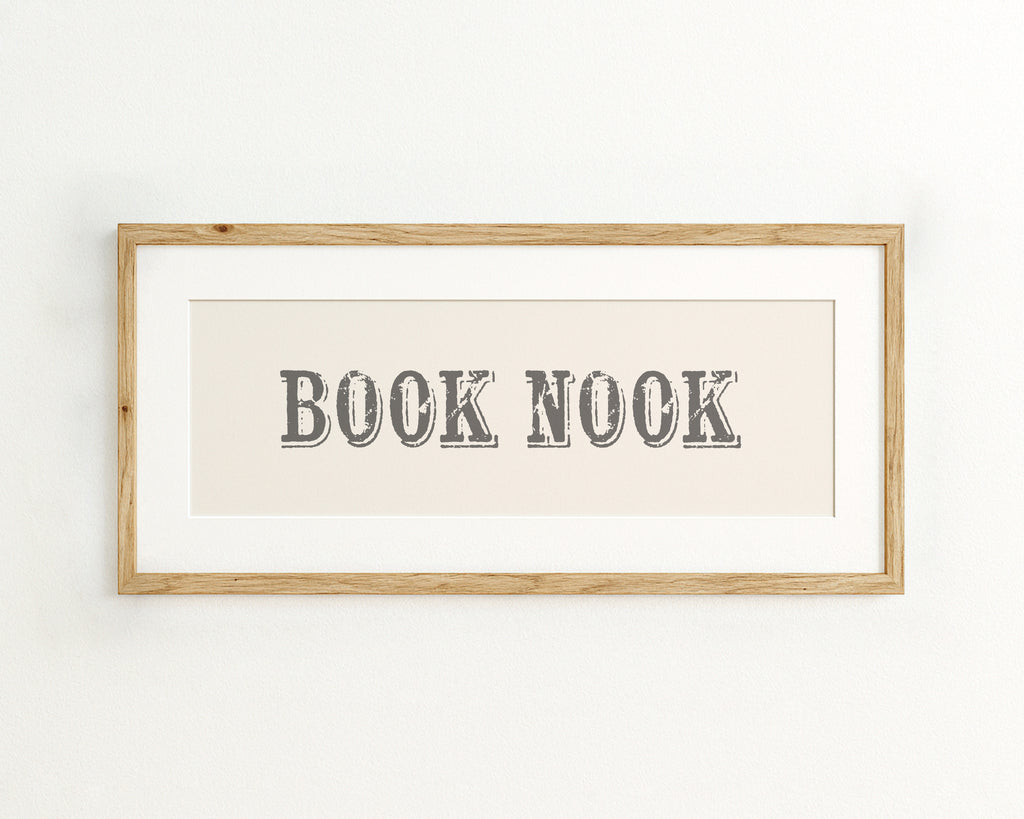 Framed artwork with 'BOOK NOOK' text on a cream background