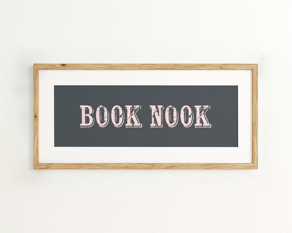 Framed artwork with 'BOOK NOOK' text on a dark blue background