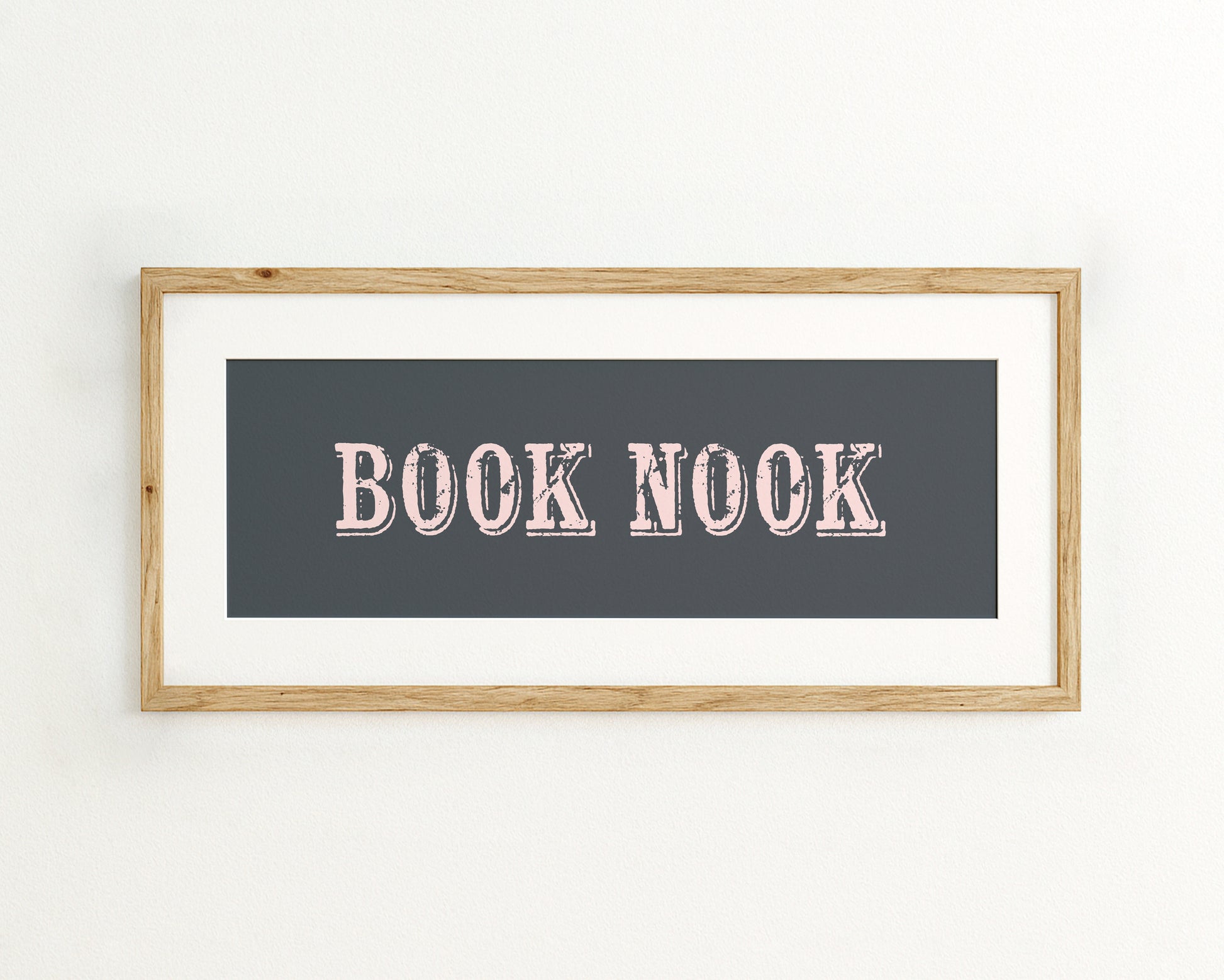 Framed artwork with 'BOOK NOOK' text on a dark blue background