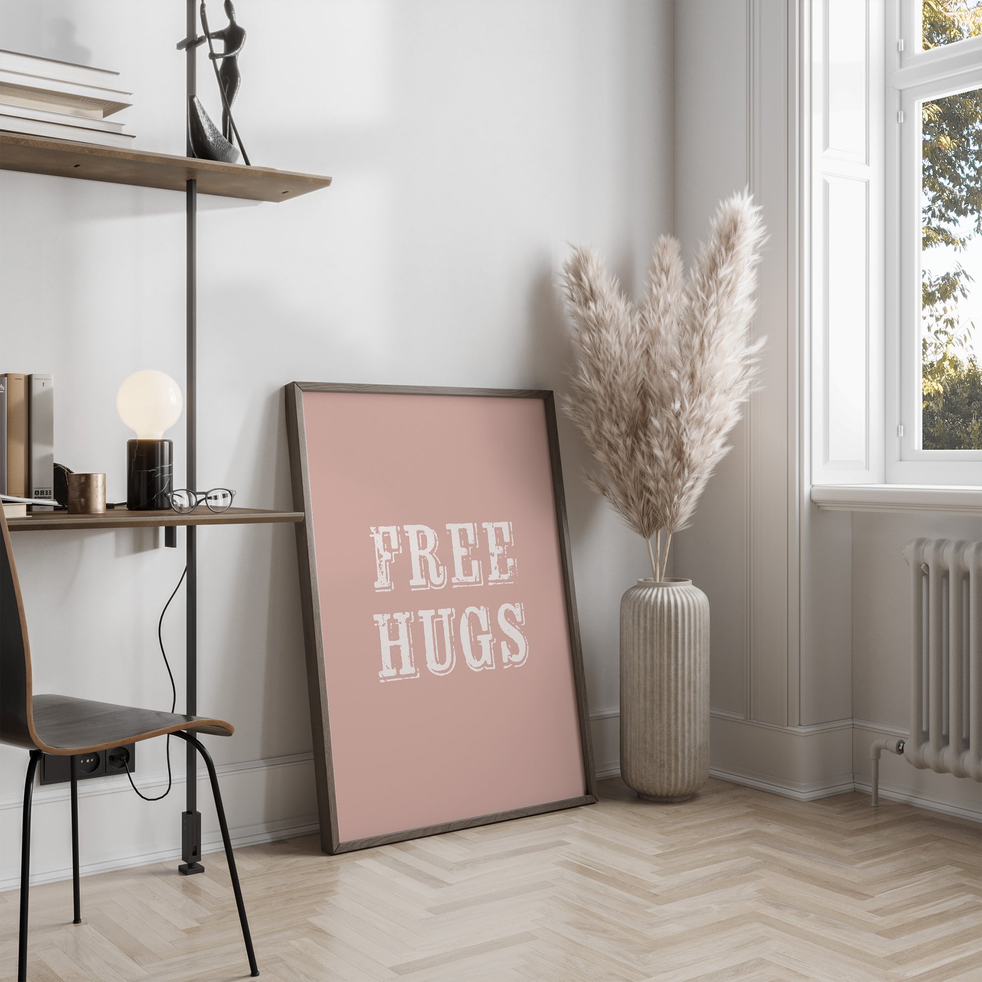Room interior with a 'FREE HUGS' poster on a wall, a vase with dried plants, and a shelf.