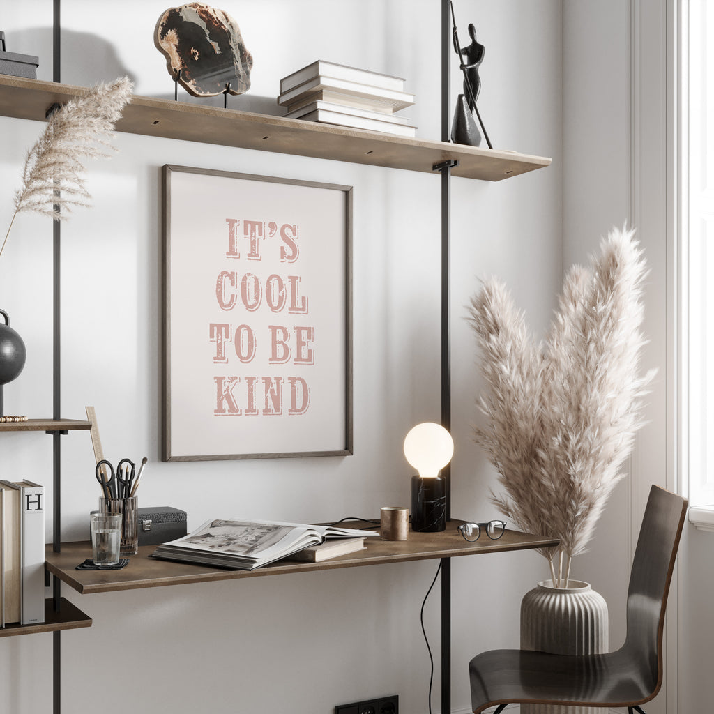 Modern home office with a desk, chair, motivational print and decorative elements.