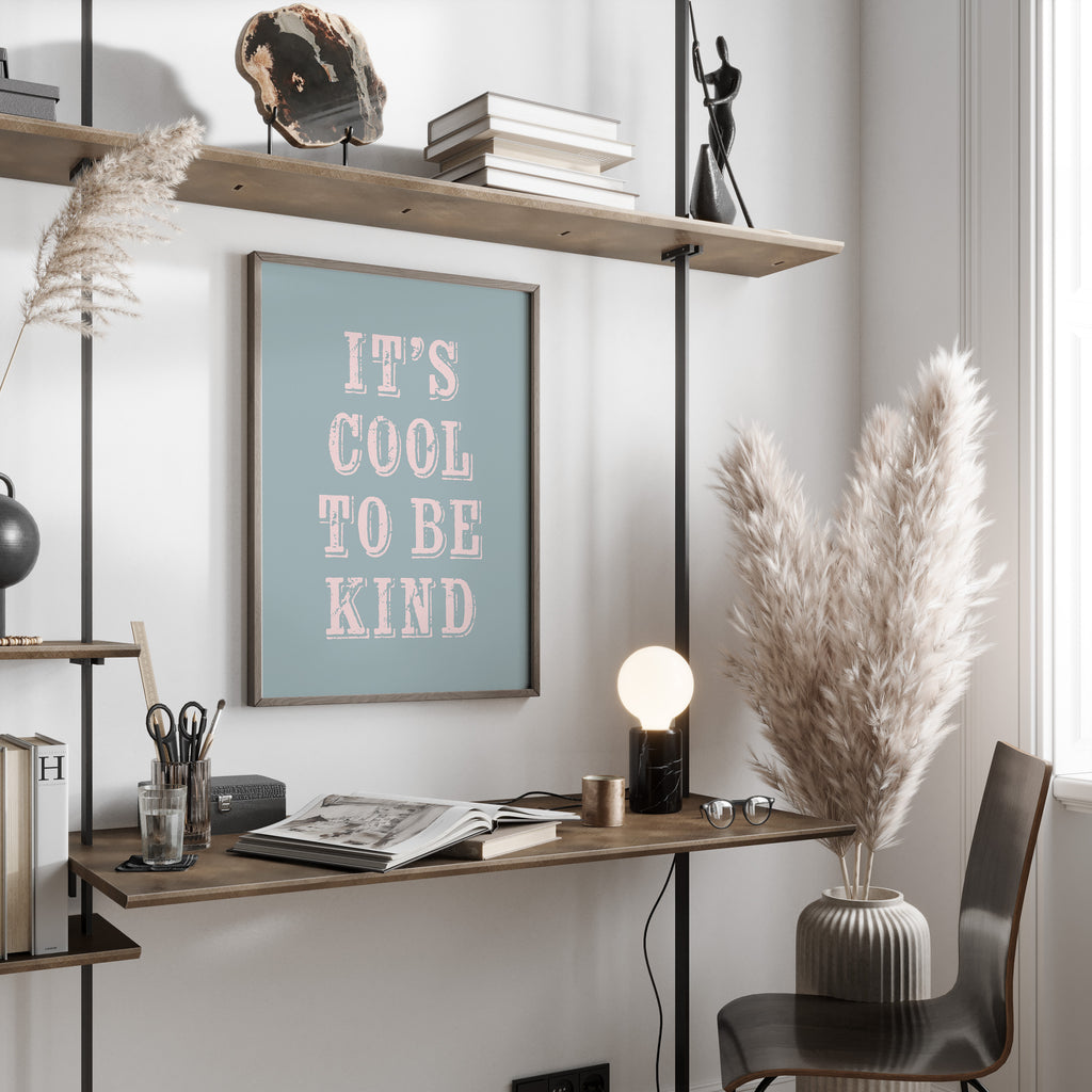 Modern office space with a desk, chair, and motivational poster on a wall.