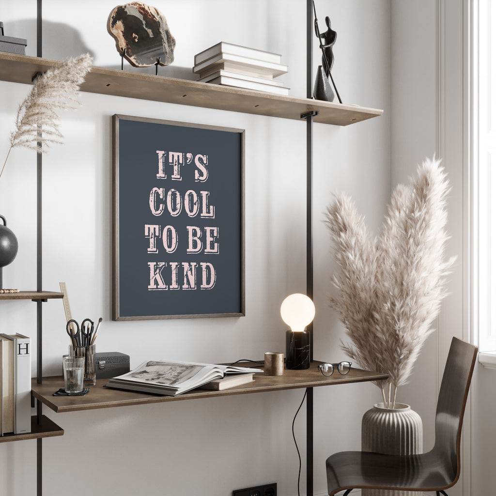 Modern office space with a desk, chair, and framed print on the wall.