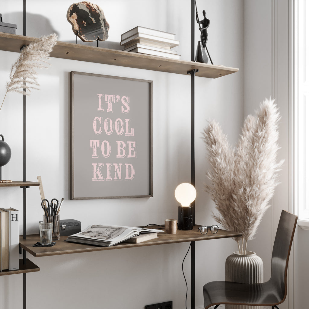 Modern home office with a desk, chair, motivational print and decorative elements.