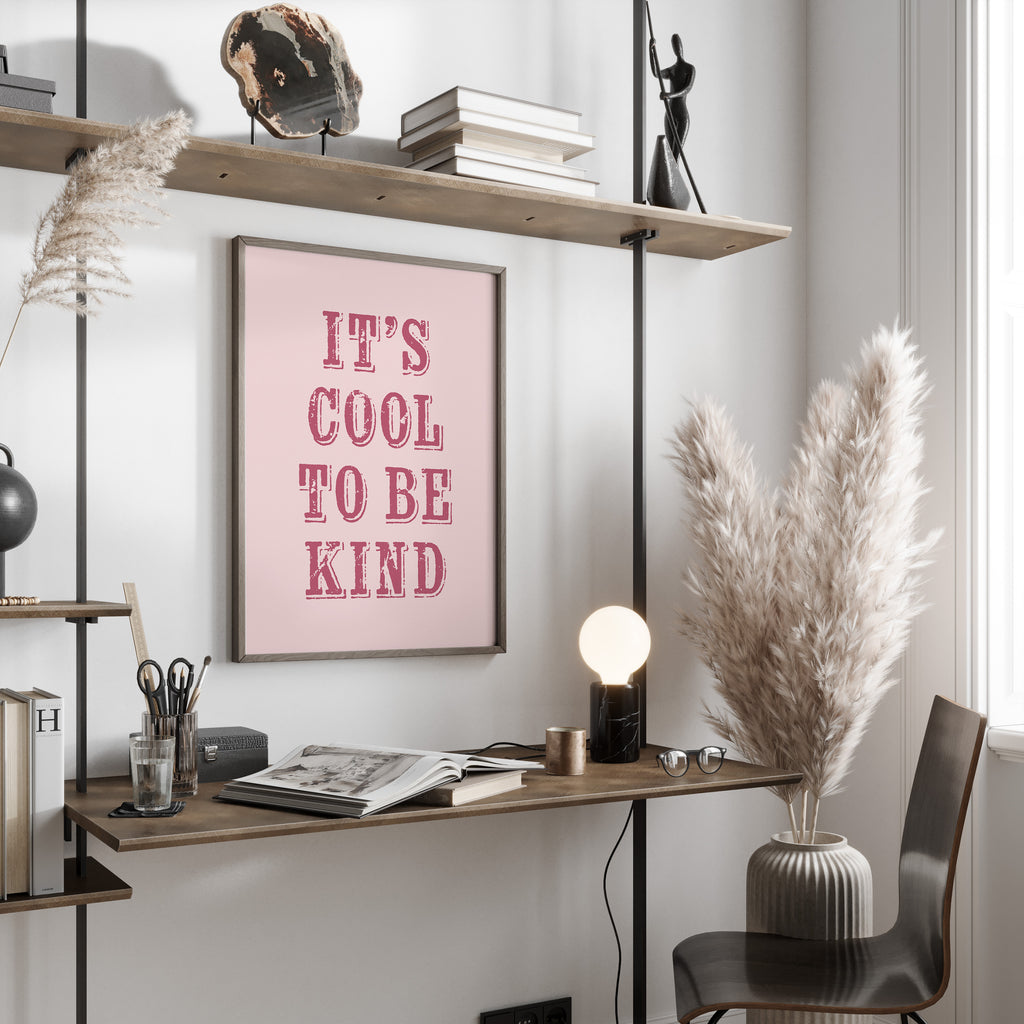 Modern office space with a desk, chair, and motivational poster on a wall.