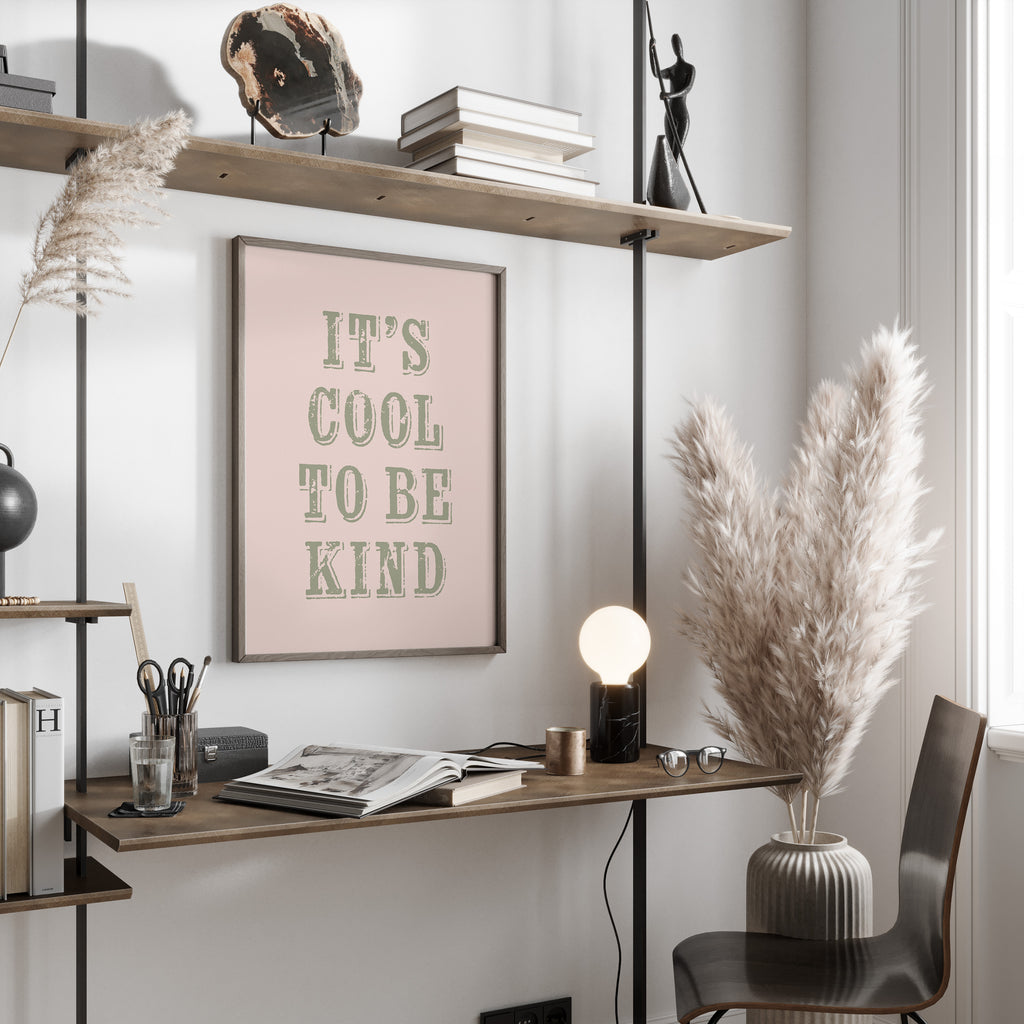 Modern home office with a desk, chair, motivational print and decorative elements.