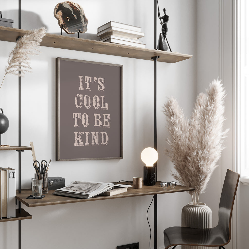 Modern office space with a desk, chair, and motivational poster on a wall.