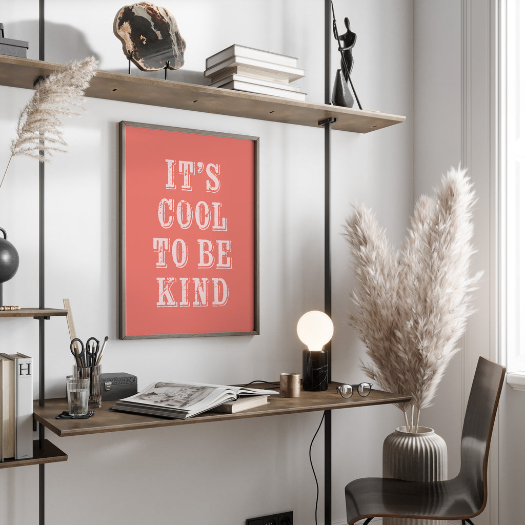 Modern office space with a desk, chair, and motivational poster on a wall.