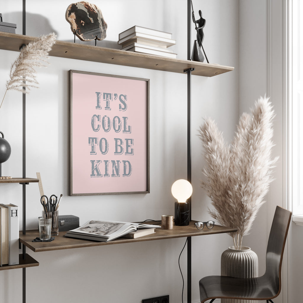 Modern office space with a desk, chair, and motivational poster on a wall.