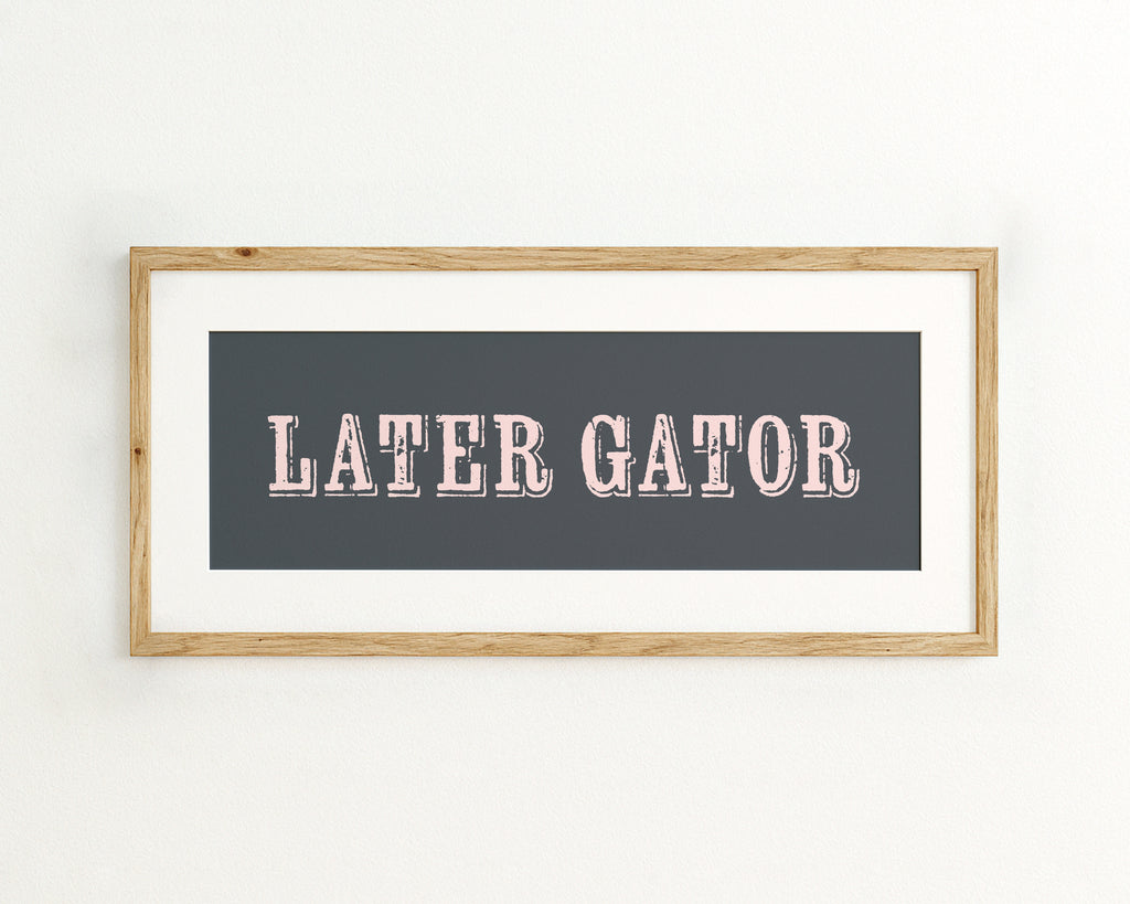 Framed print with 'LATER GATOR' text on a dark blue background
