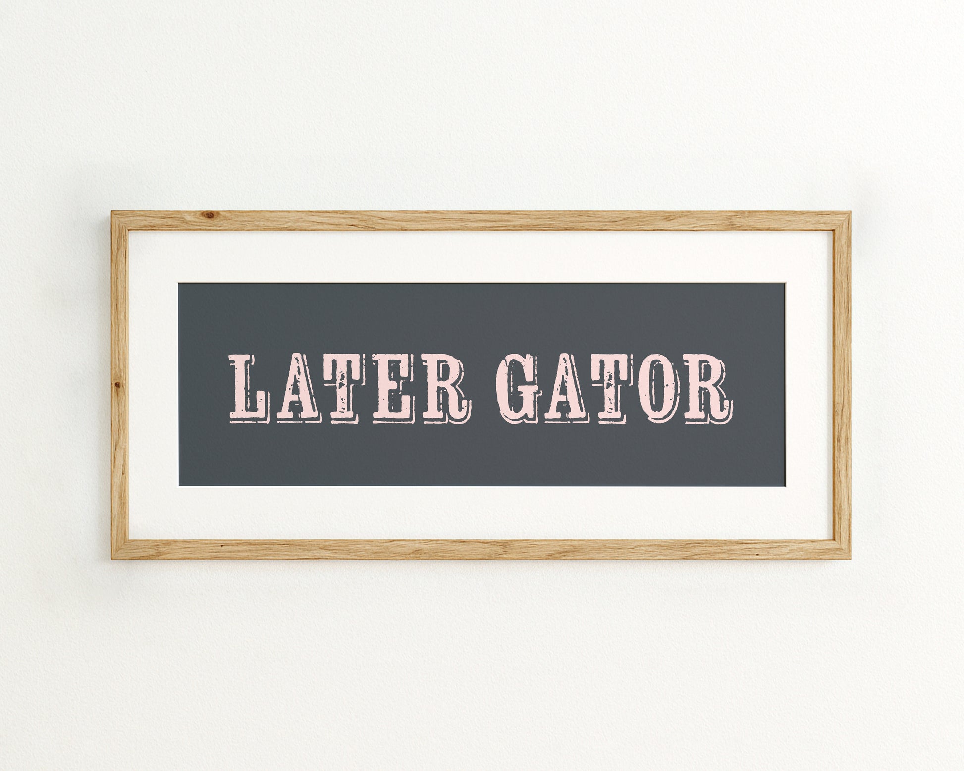 Framed print with 'LATER GATOR' text on a dark blue background
