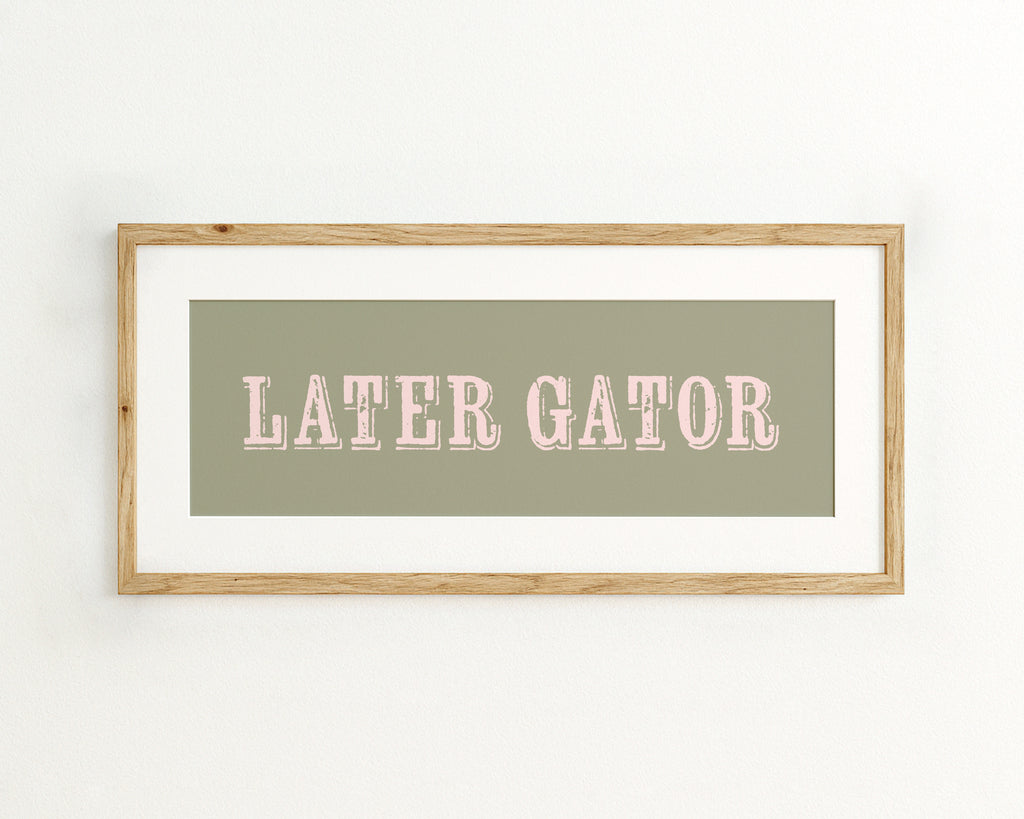 Framed print with 'LATER GATOR' text on a light green background