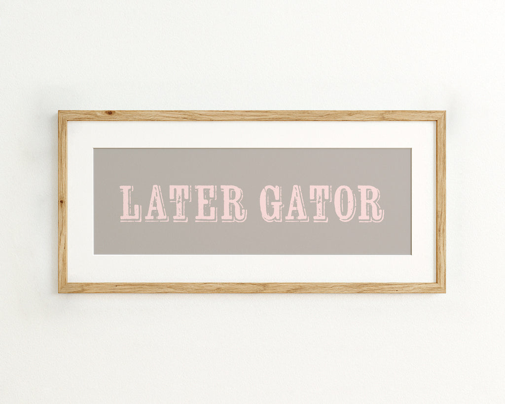 Framed print with 'LATER GATOR' text on a grey background