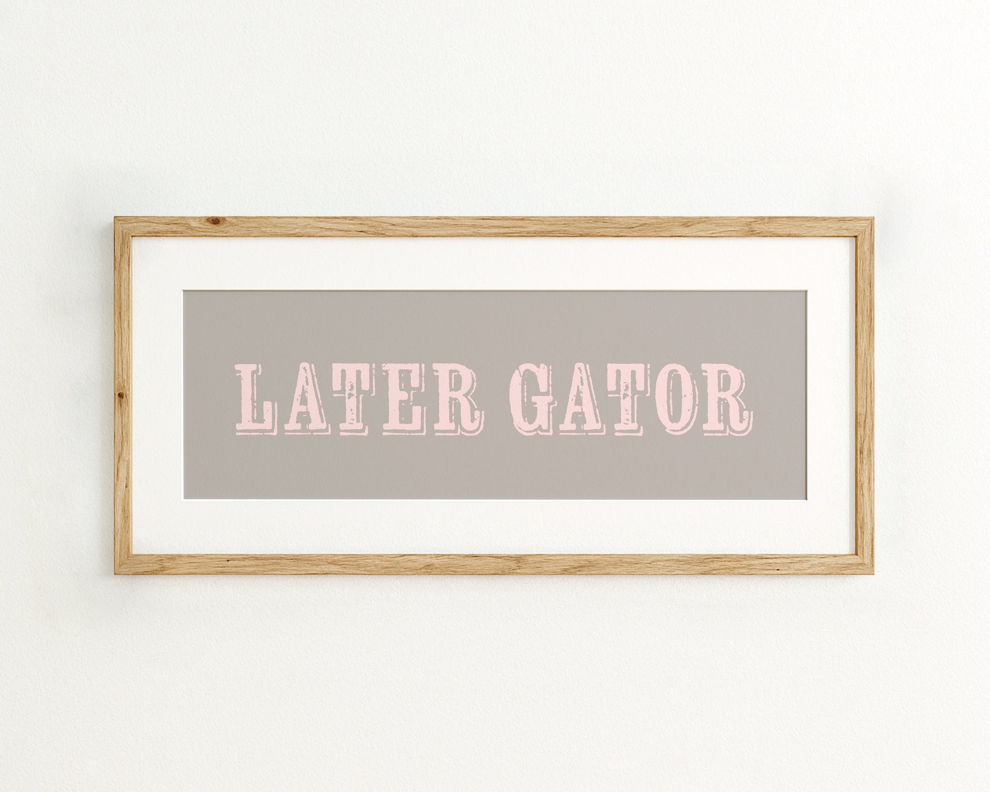 Framed print with 'LATER GATOR' text on a grey background