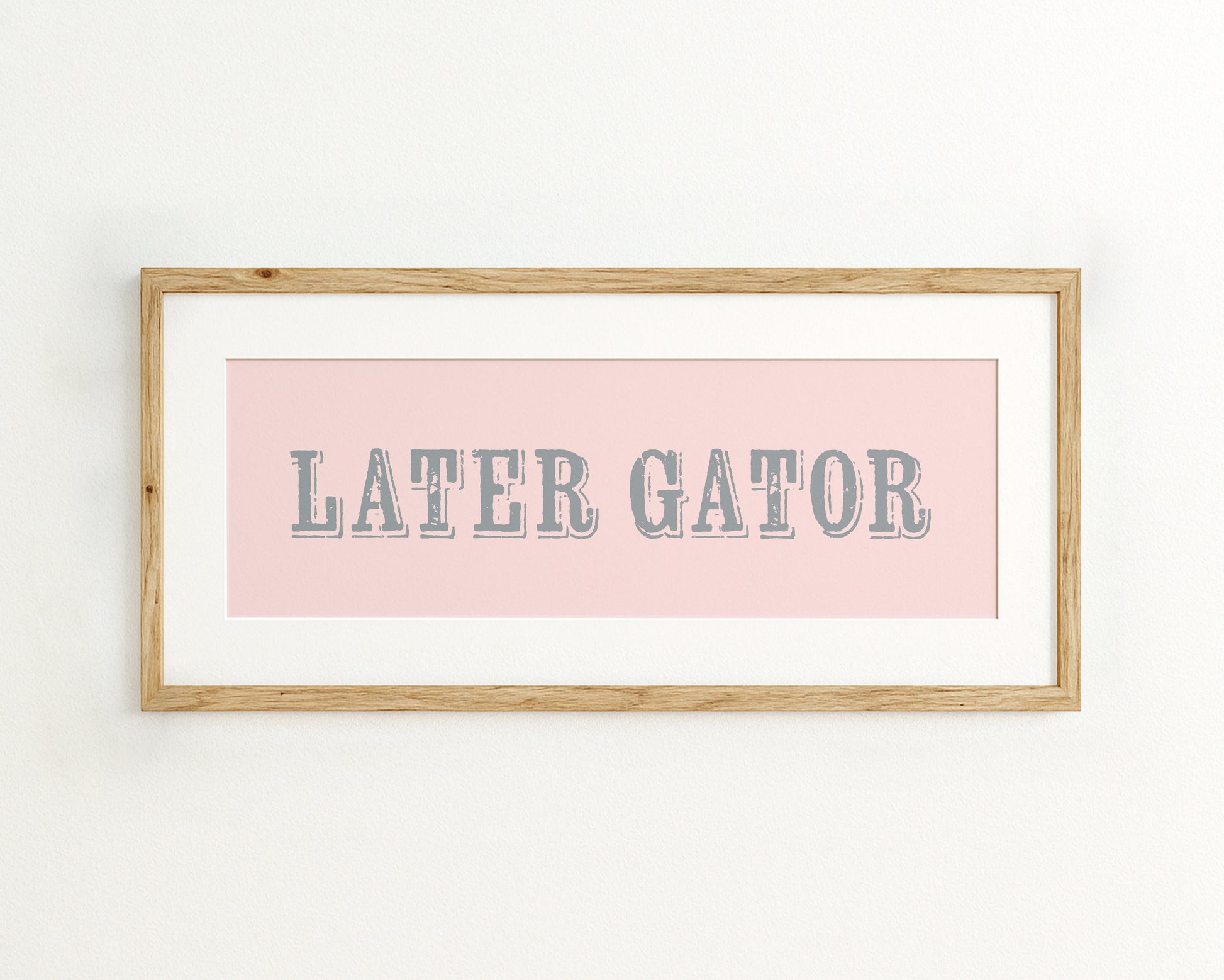 Framed print with 'LATER GATOR' text on a pink background