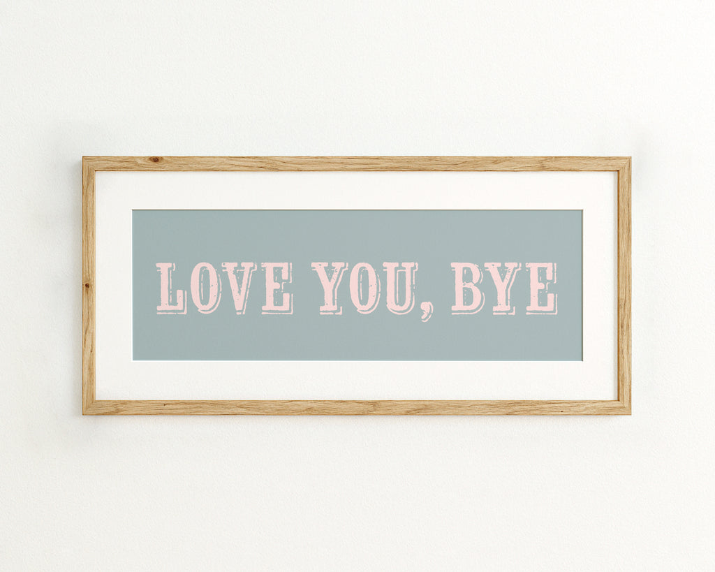Framed artwork with 'LOVE YOU, BYE' text on a light blue background