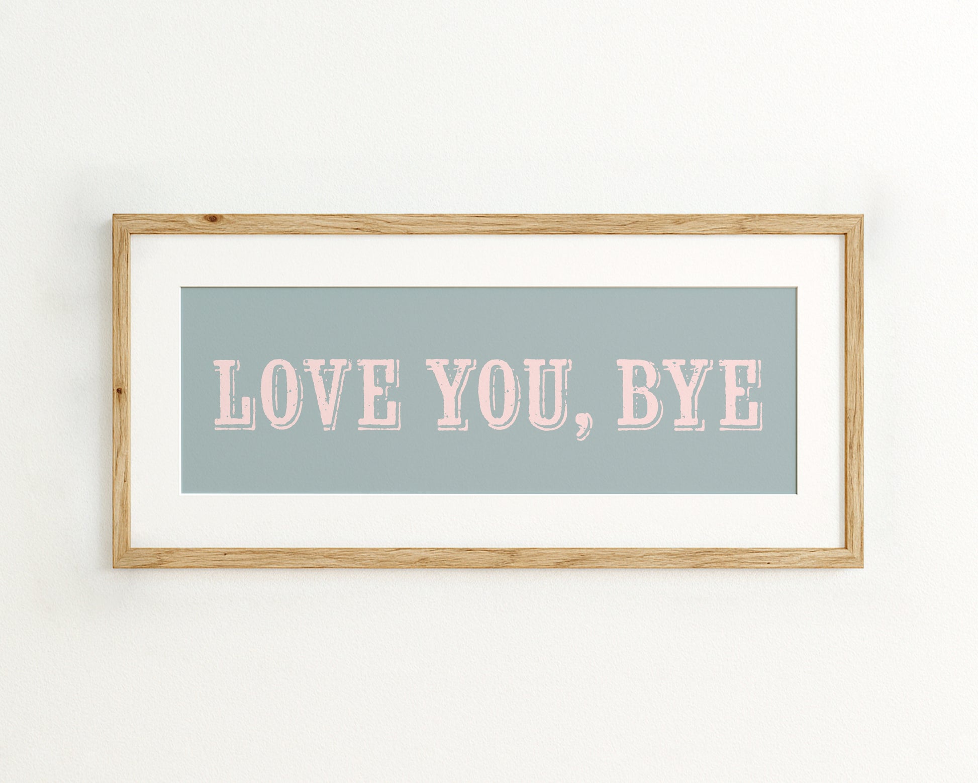 Framed artwork with 'LOVE YOU, BYE' text on a light blue background