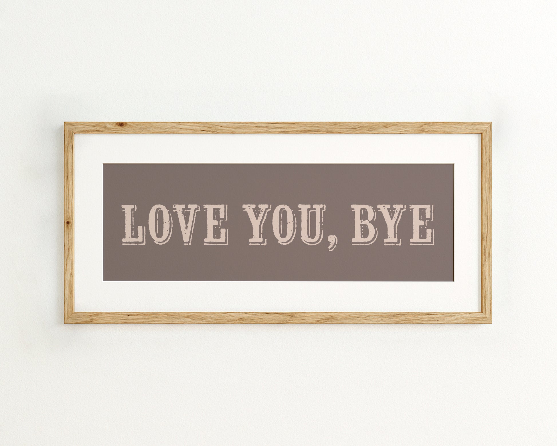 Framed artwork with 'LOVE YOU, BYE' text on a plain background