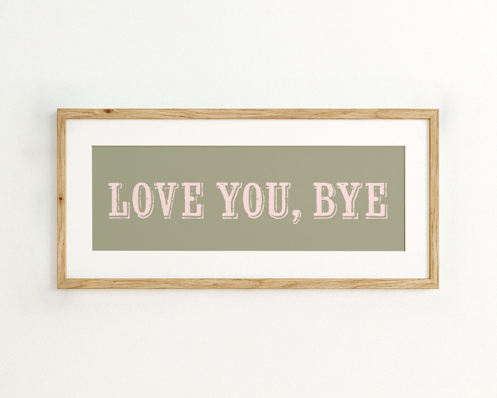 Framed artwork with 'LOVE YOU, BYE' text on a light green background