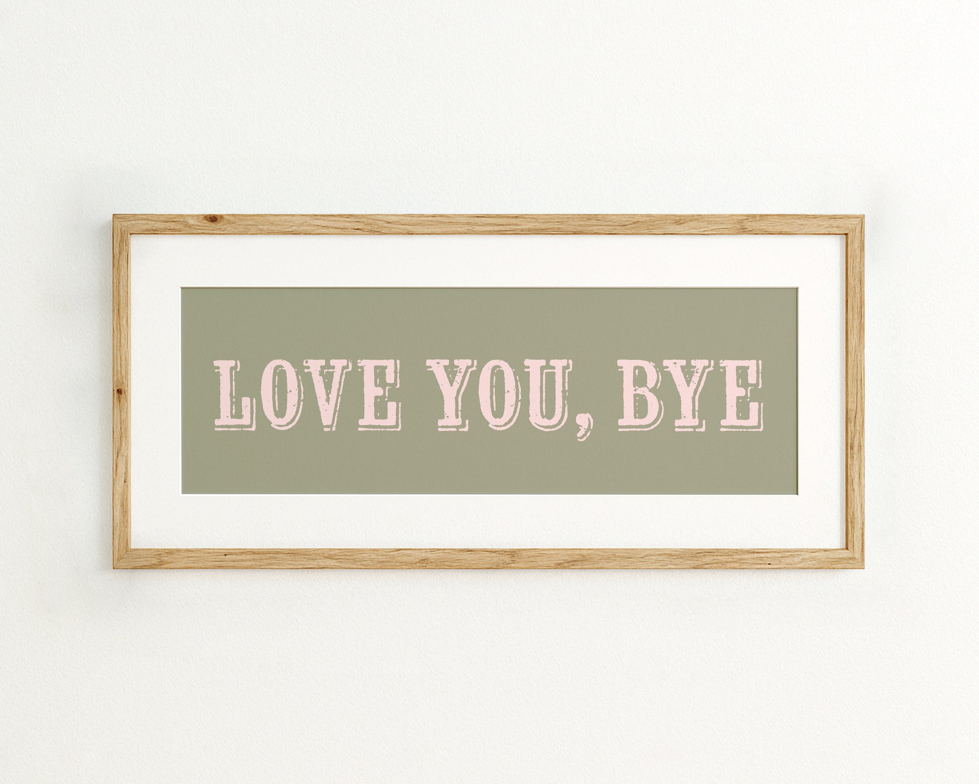 Framed artwork with 'LOVE YOU, BYE' text on a light green background