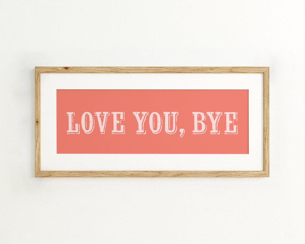 Framed artwork with 'LOVE YOU, BYE' text on a coral pink background