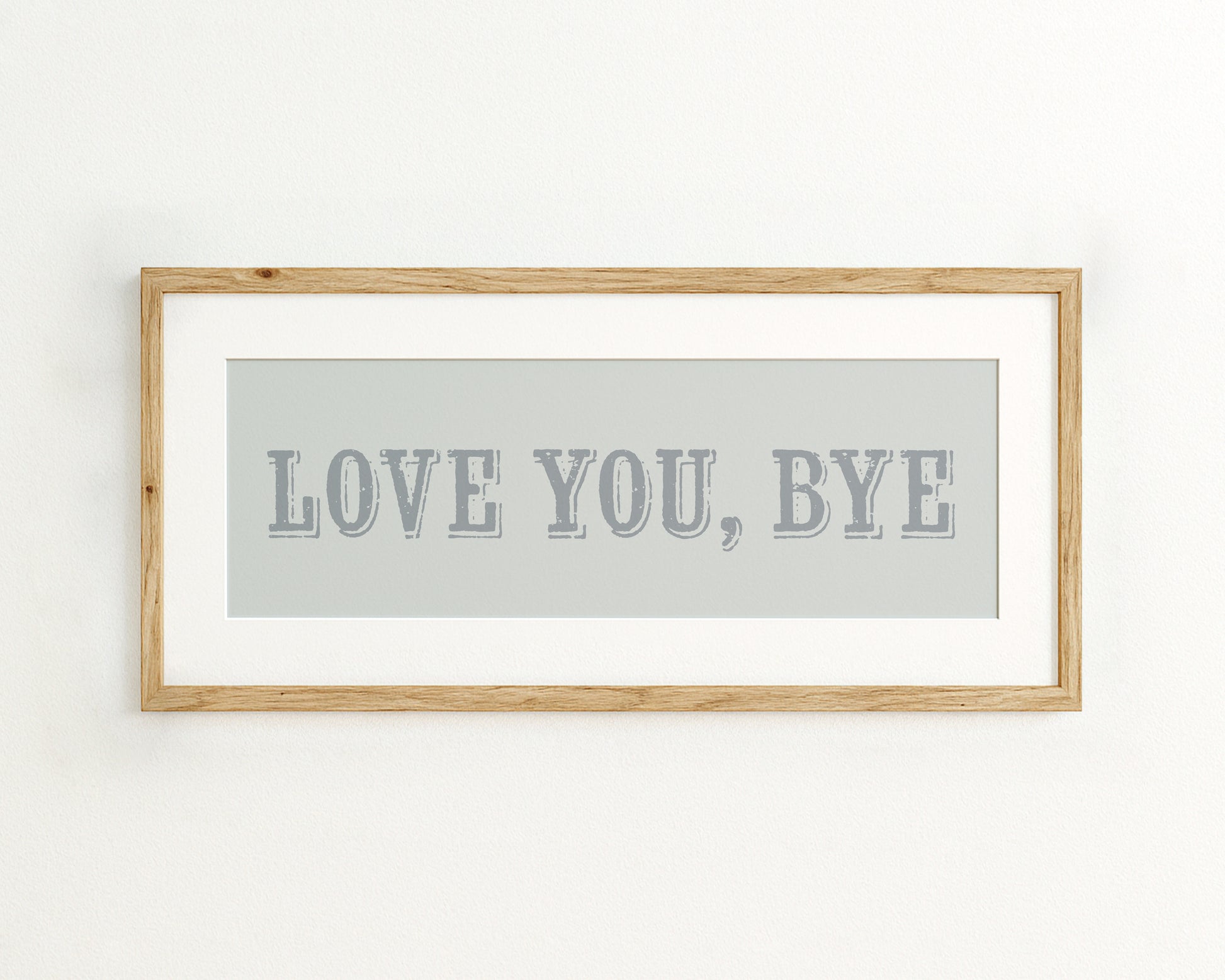 Framed artwork with 'LOVE YOU, BYE' text on a light blue background