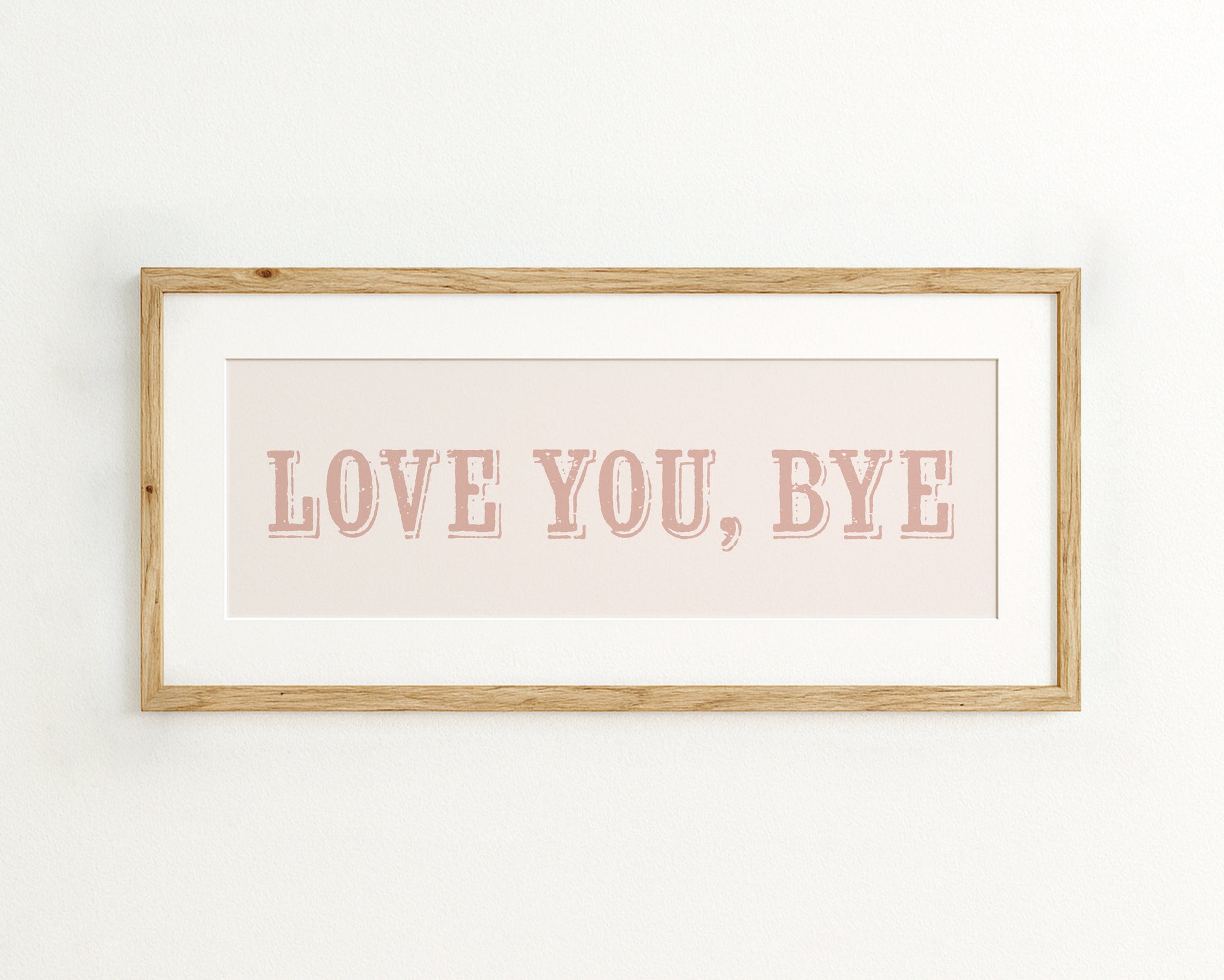 Framed artwork with 'LOVE YOU, BYE' text on a light background