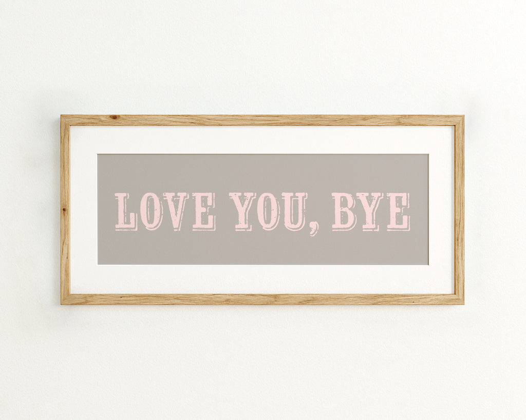 Framed artwork with 'LOVE YOU, BYE' text on a grey background