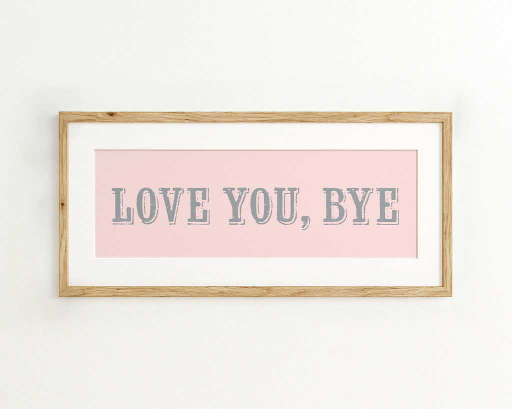 Framed artwork with 'LOVE YOU, BYE' text on a pink background