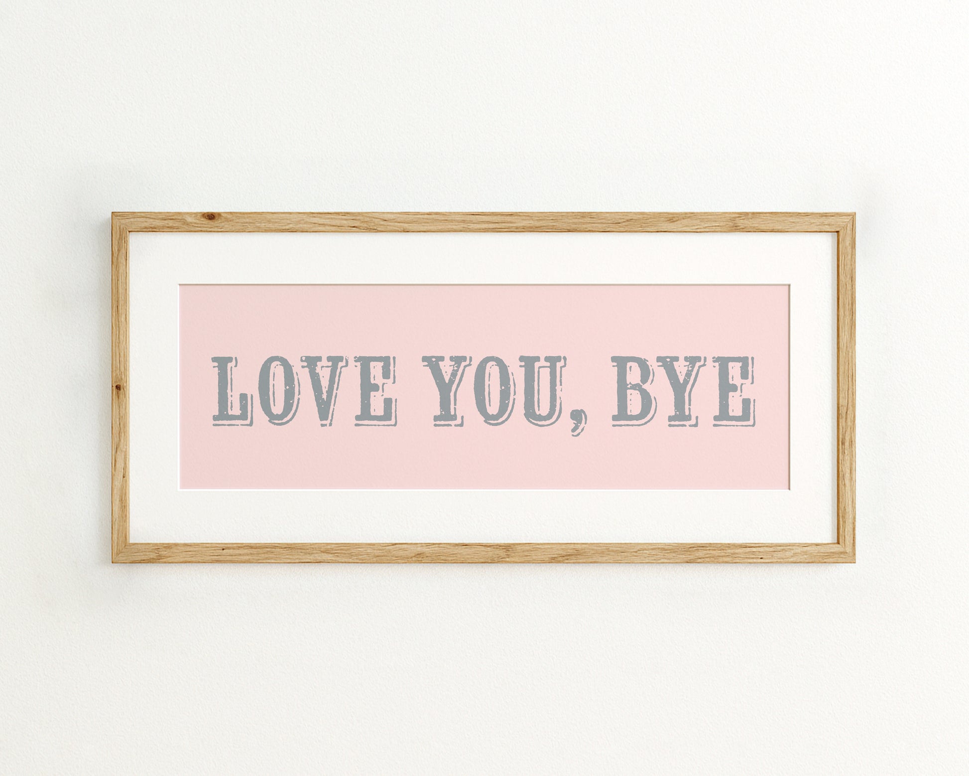 Framed artwork with 'LOVE YOU, BYE' text on a pink background