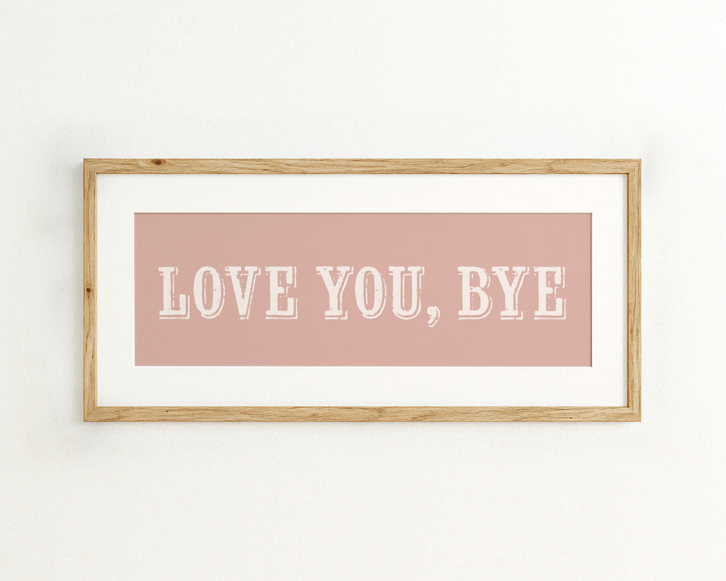 Framed artwork with 'LOVE YOU, BYE' text on a pink background