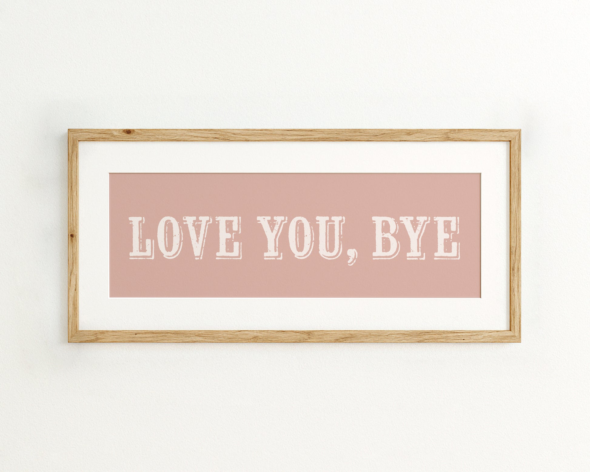 Framed artwork with 'LOVE YOU, BYE' text on a pink background