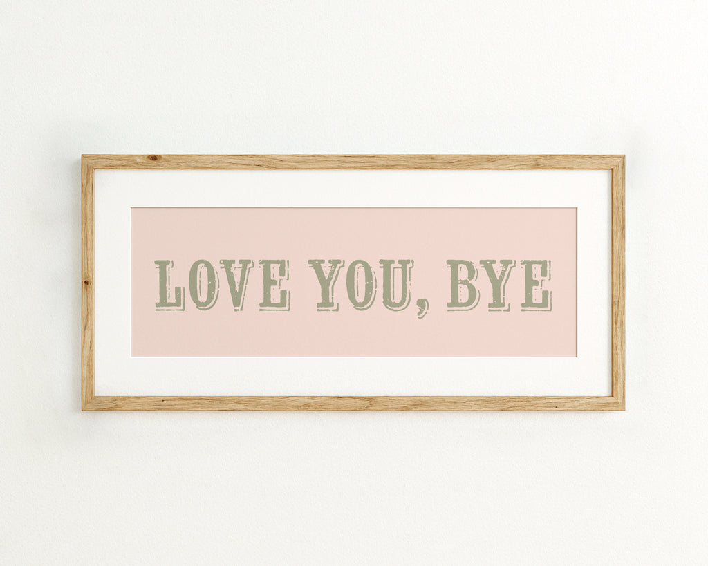 Framed artwork with 'LOVE YOU, BYE' text on a pink background