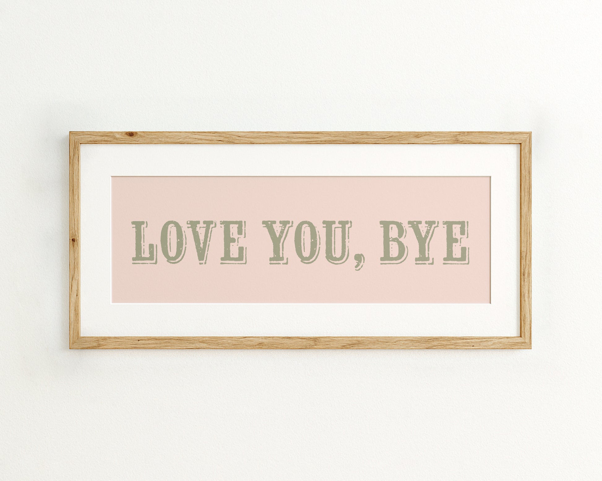 Framed artwork with 'LOVE YOU, BYE' text on a pink background