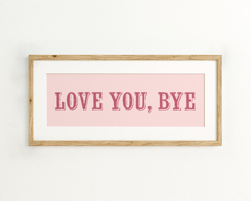 Framed artwork with 'LOVE YOU, BYE' text on a pink background