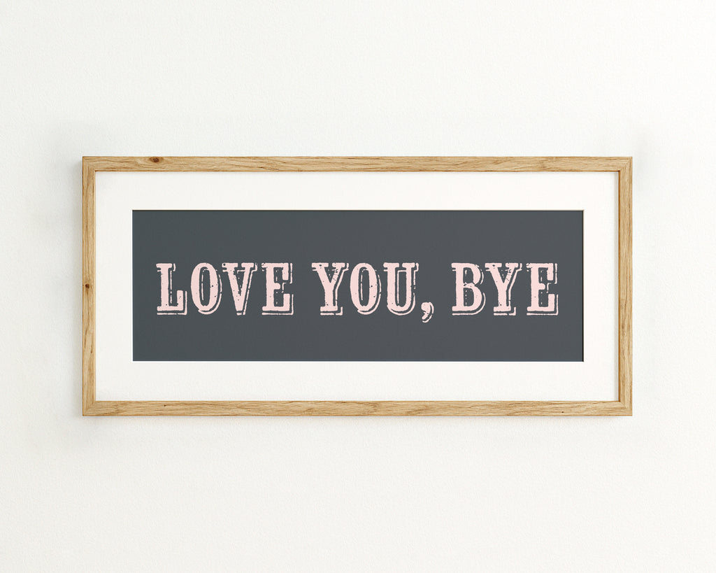 Framed artwork with 'LOVE YOU, BYE' text on a dark blue background